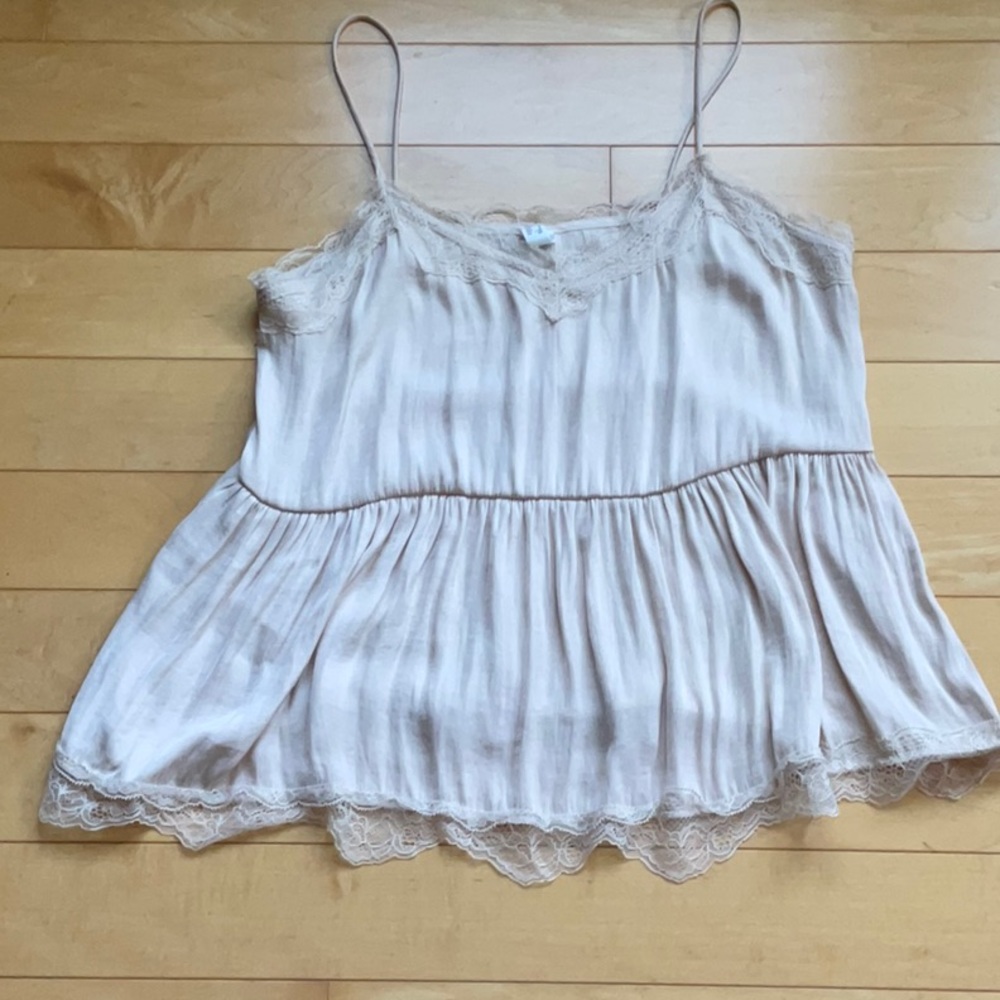 Antique white spaghetti strap top with lace.  Loose fitting.
